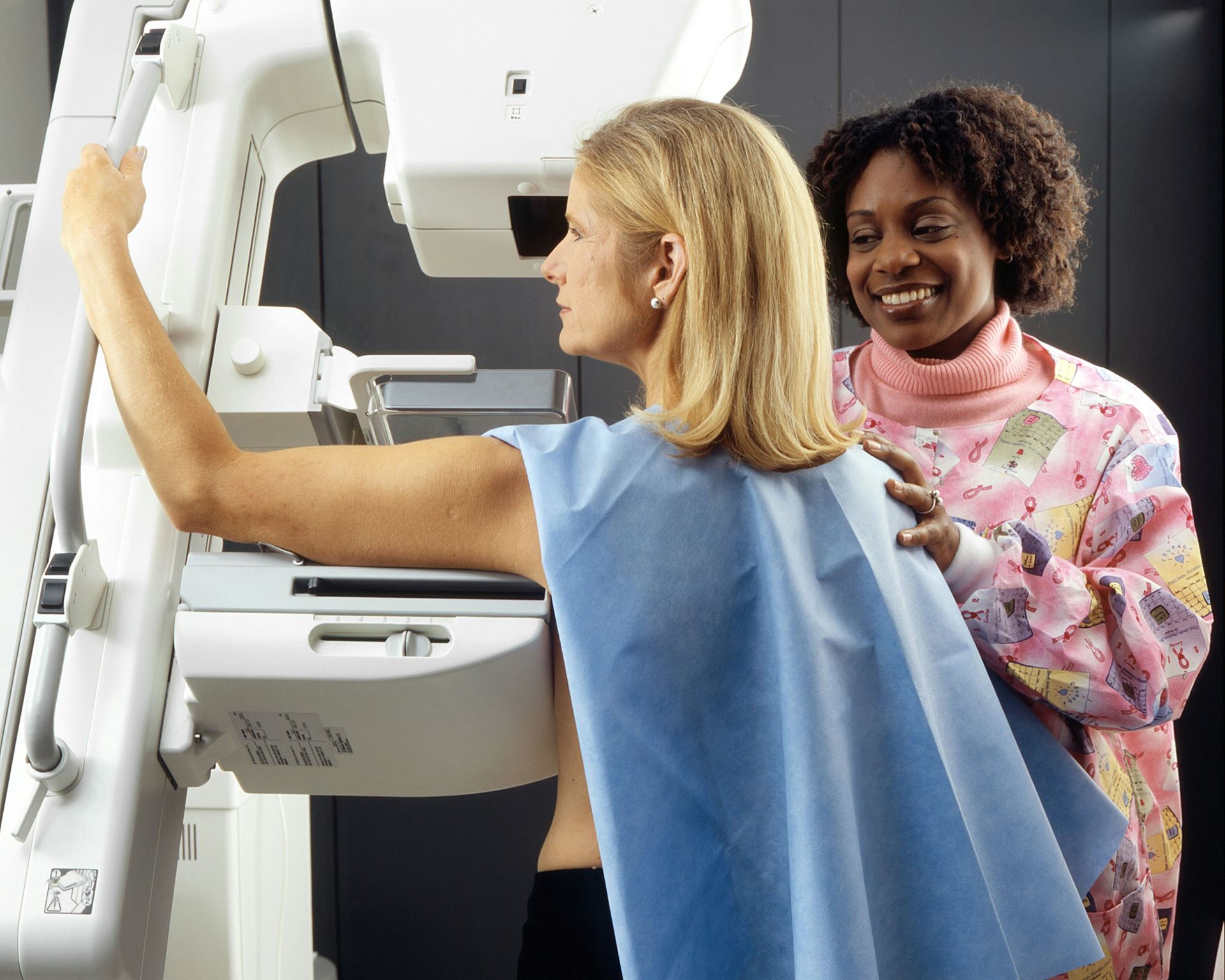 a woman having a mammogram